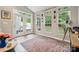 Sunroom with a tile floor, windows and sliding glass door at 108 N Arcadian Way, Mooresville, NC 28117