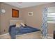 Cozy bedroom with a comfortable-looking bed, soft linens, and natural light from the window at 1111 Green Street Ext, Rock Hill, SC 29730