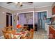 Eat-in kitchen with colorful quilt-patterned tablecloth and view of laundry area through open doorway at 1111 Green Street Ext, Rock Hill, SC 29730