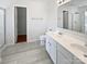 Bathroom with double sink vanity, tile flooring, and a separate shower at 1184 Lempster Nw Dr, Concord, NC 28027
