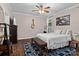 Bedroom featuring hardwood floors, ceiling fan, a white bed, and a painting of jellyfish on the wall at 1201 Pegram St, Charlotte, NC 28205