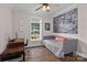 Charming bedroom featuring a window view, wood floors, and modern decor with a comfortable bed at 1201 Pegram St, Charlotte, NC 28205