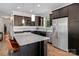 Well-equipped kitchen featuring stainless steel appliances, a center island, and modern cabinetry at 1201 Pegram St, Charlotte, NC 28205