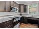 Stylish kitchen with stainless steel appliances, sleek cabinets, and quartz countertops at 1201 Pegram St, Charlotte, NC 28205