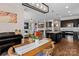 Open-concept kitchen with dark cabinetry, stainless appliances, and a large center island at 1201 Pegram St, Charlotte, NC 28205