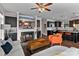Open floor plan with fireplace, television, and kitchen view; stylish decor and wood flooring at 1201 Pegram St, Charlotte, NC 28205