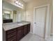 Bathroom features a large mirror, granite countertop, and a dark vanity cabinet at 1281 Arges River Dr, Fort Mill, SC 29715
