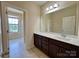 Bathroom featuring a granite countertop vanity and a glass shower at 1281 Arges River Dr, Fort Mill, SC 29715