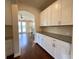 Hallway leading to kitchen area, featuring hardwood floors at 1281 Arges River Dr, Fort Mill, SC 29715