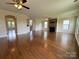 Spacious living room with hardwood floors, stone fireplace, and seamless transition to other areas of the home at 1281 Arges River Dr, Fort Mill, SC 29715