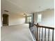 Upstairs loft space with neutral carpet and a ceiling fan at 1281 Arges River Dr, Fort Mill, SC 29715