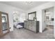 Spacious bedroom with a large dresser, carpet, and view to another bedroom at 1300 Nc 90 W Hwy, Taylorsville, NC 28681