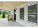 Inviting front porch with cozy decor, plants, and a 'Welcome' sign, creating a warm entry at 1300 Nc 90 W Hwy, Taylorsville, NC 28681