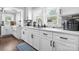 Bright kitchen features white cabinetry, modern appliances, and stylish backsplash at 1300 Nc 90 W Hwy, Taylorsville, NC 28681