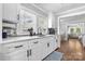 The kitchen offers ample counter space, white cabinets and modern fixtures at 1300 Nc 90 W Hwy, Taylorsville, NC 28681