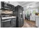 Well-equipped kitchen with stainless steel appliances and stone backsplash, offering modern convenience and style at 1300 Nc 90 W Hwy, Taylorsville, NC 28681