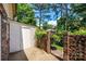 Private backyard featuring a storage shed, brick wall, and iron gate at 1330 5Th Ne St, Hickory, NC 28601