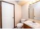 Clean bathroom featuring a toilet, sink, vanity, medicine cabinet, and door at 1330 5Th Ne St, Hickory, NC 28601