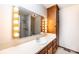 Bathroom featuring vanity with Hollywood lights, a mirror, and a shower area, offering a functional design at 1330 5Th Ne St, Hickory, NC 28601