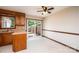 Kitchen with sliding glass doors to backyard, vinyl floors and wood cabinets at 1330 5Th Ne St, Hickory, NC 28601