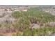 A beautiful wooded property features a home tucked away among the trees, offering seclusion and access to nature at 1370 Poole Rd, Salisbury, NC 28146