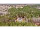 Expansive wooded acreage with a charming home nestled among the trees, offering privacy and a serene natural setting at 1370 Poole Rd, Salisbury, NC 28146