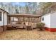 Spacious covered porch featuring wooden railings, steps, and a swing for relaxation at 1370 Poole Rd, Salisbury, NC 28146