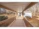 Covered walkway featuring wood railings, and providing access to an adjacent structure at 1370 Poole Rd, Salisbury, NC 28146