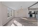 Bright dining room area with large windows and an elegant chandelier at 1370 Poole Rd, Salisbury, NC 28146