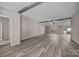Expansive living room features neutral walls, beam accents, ample windows, and laminate flooring for a warm atmosphere at 1370 Poole Rd, Salisbury, NC 28146