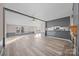 Bright, open-concept living area with a breakfast bar, light walls, and laminate flooring to enhance the modern look at 1370 Poole Rd, Salisbury, NC 28146
