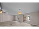 Bright living area with slider doors to the deck, light walls, and laminate flooring to enhance a relaxed and casual feel at 1370 Poole Rd, Salisbury, NC 28146