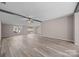 Spacious, airy living room featuring beam accents, large windows, and modern laminate flooring for a comfortable living space at 1370 Poole Rd, Salisbury, NC 28146