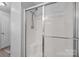 Clean white shower stall with modern fixtures and sliding glass door at 1370 Poole Rd, Salisbury, NC 28146