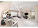 Spacious bonus room featuring a ceiling fan, exercise equipment, television, and neutral decor at 14701 Jockeys Ridge Dr, Charlotte, NC 28277