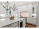 Bright kitchen features a center island, custom cabinets, and stainless steel range at 14701 Jockeys Ridge Dr, Charlotte, NC 28277