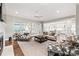 Spacious living room with fireplace, hardwood floors, and view into kitchen at 14701 Jockeys Ridge Dr, Charlotte, NC 28277