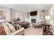 Cozy living room with a fireplace, built-in shelving, and comfortable seating at 14701 Jockeys Ridge Dr, Charlotte, NC 28277