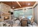 Inviting outdoor dining area with a stone fireplace and a view of the pool at 14701 Jockeys Ridge Dr, Charlotte, NC 28277