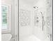 Elegant shower with white subway tile, decorative mosaic tile accent, and glass door enclosure at 14701 Jockeys Ridge Dr, Charlotte, NC 28277