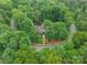 A lovely home sits in a cul-de-sac surrounded by mature shade trees at 157 Dedham Loop, Mooresville, NC 28117