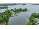 An aerial view of a neighborhood, marina and lake at 157 Dedham Loop, Mooresville, NC 28117