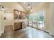Stylish bar area with custom cabinetry, pendant lighting, and access to an outdoor patio at 157 Dedham Loop, Mooresville, NC 28117