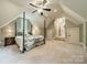 Charming bedroom with a unique ceiling fan and a four-poster bed at 157 Dedham Loop, Mooresville, NC 28117