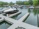 A marina boat dock filled with assorted recreational boats on a sunny day at 157 Dedham Loop, Mooresville, NC 28117