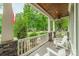 Inviting front porch with white Adirondack chairs and a wood ceiling, perfect for relaxing outdoors at 157 Dedham Loop, Mooresville, NC 28117