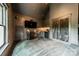 Home theater with kitchenette, gray carpet, and large TV at 157 Dedham Loop, Mooresville, NC 28117