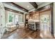 Bright kitchenette with a breakfast bar, pendant lighting, and cozy seating area with hardwood floors at 157 Dedham Loop, Mooresville, NC 28117