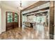 Spacious formal dining and living area featuring hardwood floors, exposed wood beams, and ample natural light at 157 Dedham Loop, Mooresville, NC 28117