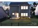 Backyard with a well manicured lawn, black metal fence and patio at 161 Old Harbor Dr, Mount Gilead, NC 27306
